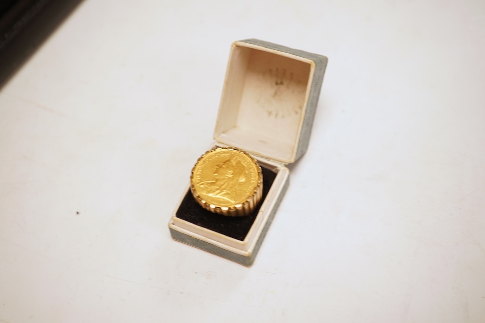 A sovereign ring, 1897 and later, set with a full sovereign dated 1897, to a fluted gold ring mount, size S (sizing band), ring mount stamped 9ct, gross weight 17 grams, Condition: typical surface wear